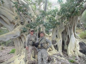 Hunters in front of tree