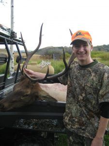 Hunter with his Elk in back of Polaris