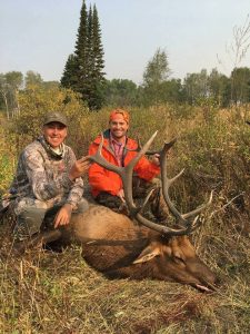 Guide from Vanatta Outfitters with hunter and his Elk