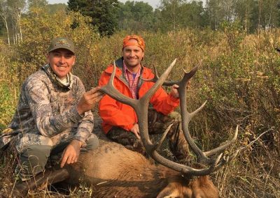 Guide from Vanatta Outfitters with hunter and his Elk
