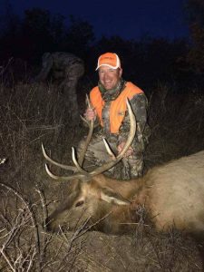 Hunter at night with his Elk