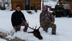 Hunter in the snow with their Elk