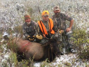 Hunters with their kill at Vanatta Outfitters