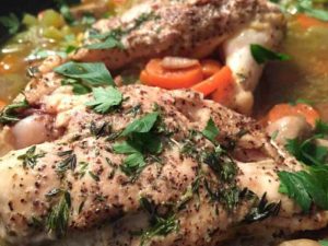 plate with chicken and herbs